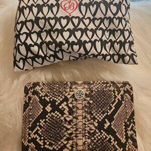 Brighton medium size leather wallet in snake skin print with silver studs.